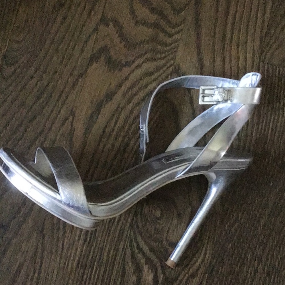 Beautiful, silver BCBGMaxazria ankle strap 4”heels with 1” platform.